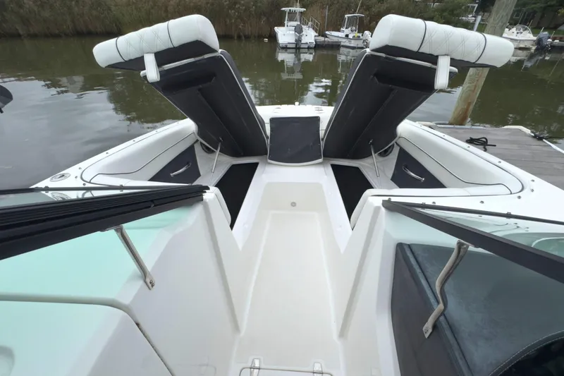 Slide: The Image of 2022 Regal 23 OBX boat interior with adjustable seating and storage compartments. - 31