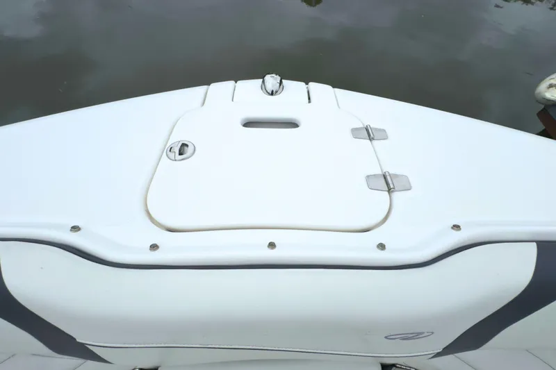 Slide: The Image of 2022 Regal 23 OBX boat deck with storage compartment, white finish. - 34