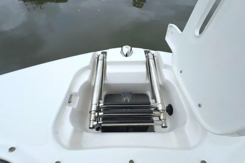 Slide: The Image of 2022 Regal 23 OBX boat with a folded stainless steel ladder on deck. - 35