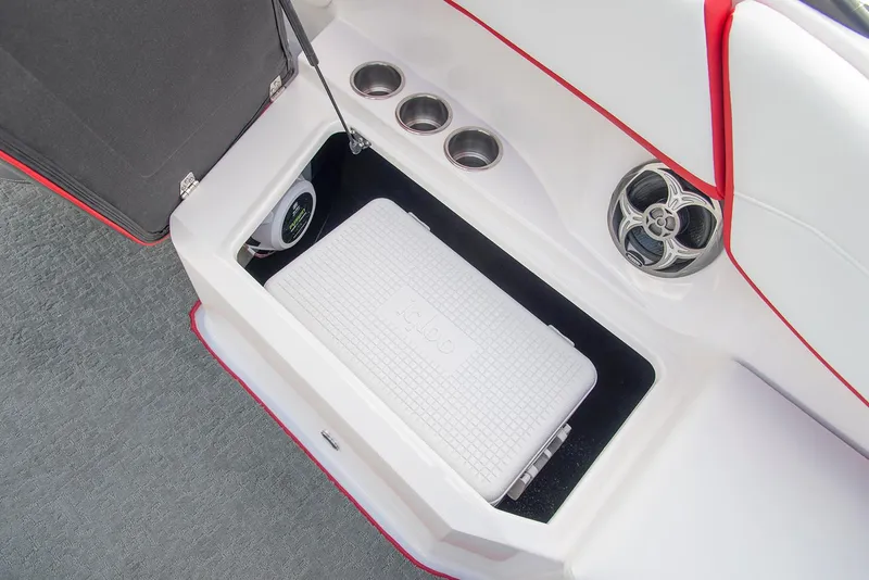 Slide: The Image of 2022 Regal 23 OBX boat with spacious seating and canopy, docked in a marina. - 7