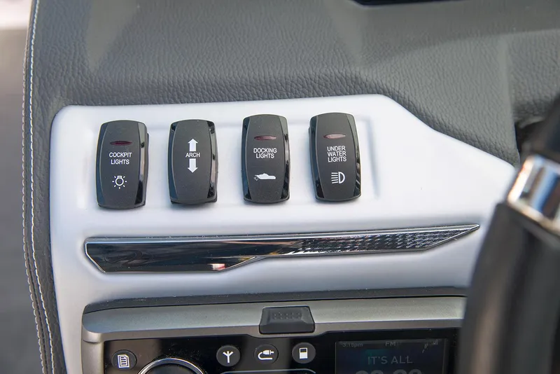 Slide: The Image of 2022 Regal 23 OBX boat interior with white cushioned seating and black accents. - 9