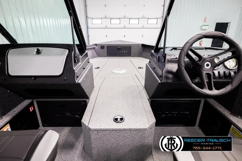 Slide: The Image of Interior view of 2026 Lund 1800 Explorer Sport boat with steering wheel and dashboard. - 24