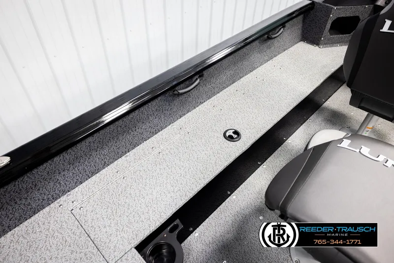 Slide: The Image of 2026 Lund 1800 Explorer Sport boat interior with seating and storage compartments. - 27