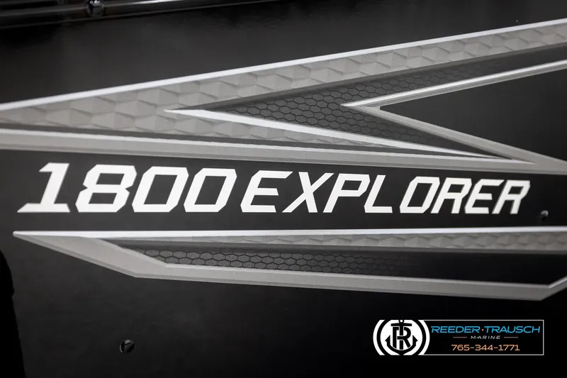 Slide: The Image of 2026 Lund 1800 Explorer Sport boat logo with geometric design and dealership contact. - 47