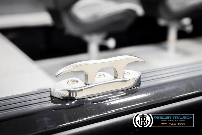 Slide: The Image of 2026 Lund 1800 Explorer Sport boat cleat detail with Reeder-Trausch Marine logo. - 49