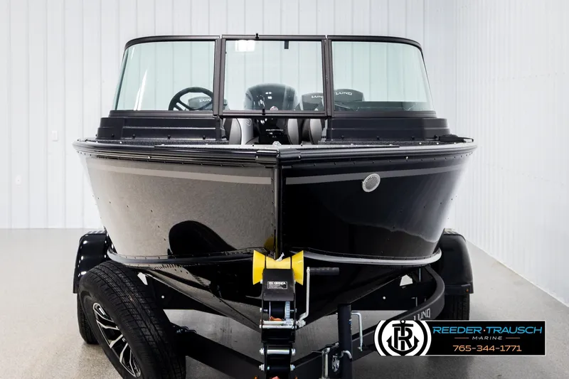 Slide: The Image of 2026 Lund 1800 Explorer Sport boat on trailer in showroom. - 6