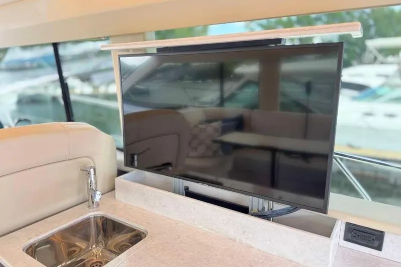 Slide: The Image of Luxurious interior of 2019 Regal 42 Fly yacht with TV and sink. - 10