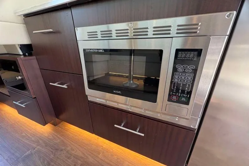 Slide: The Image of Modern kitchen with convection grill microwave on Regal 42 Fly yacht, 2019 model. - 11