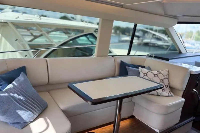 Slide: The Image of Luxurious interior of 2019 Regal 42 Fly yacht with elegant seating and cushions. - 13