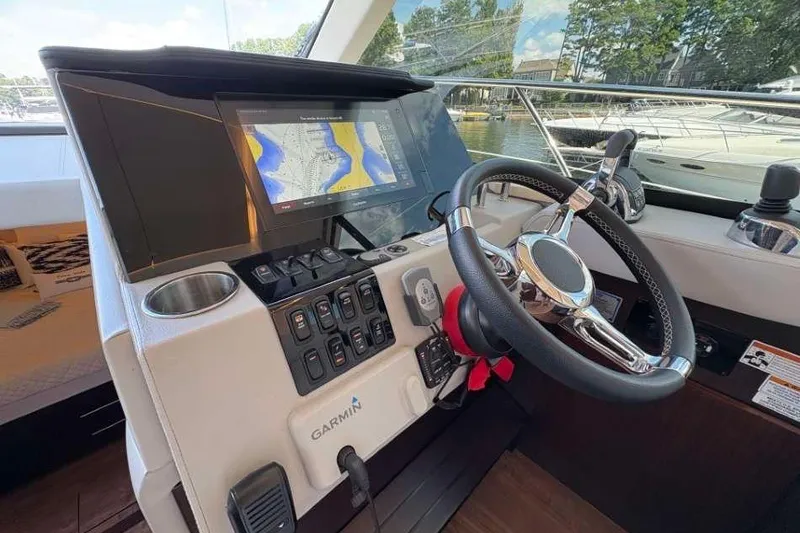 Slide: The Image of Control panel of a 2019 Regal 42 Fly yacht with Garmin navigation system. - 14
