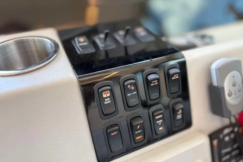 Slide: The Image of Control panel of a 2019 Regal 42 Fly yacht with labeled switches. - 17