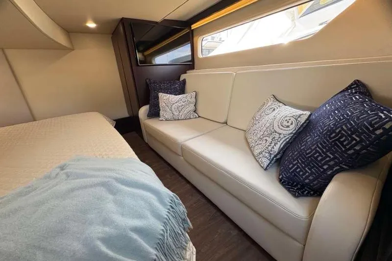 Slide: The Image of Luxurious interior of 2019 Regal 42 Fly yacht with elegant sofa and cushions. - 23