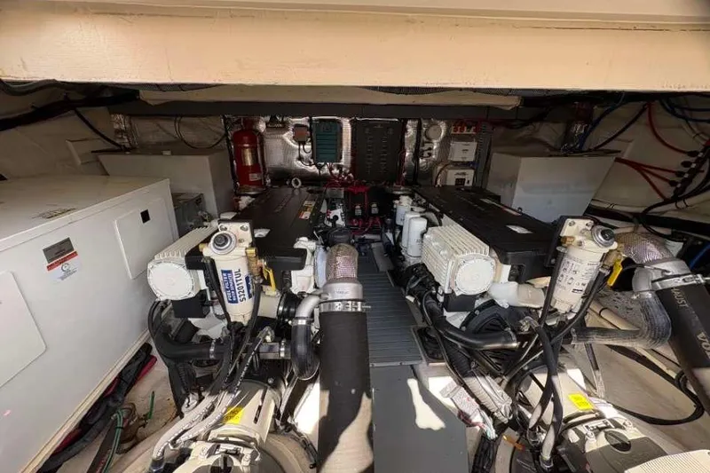 Slide: The Image of Engine room of 2019 Regal 42 Fly yacht, showcasing dual engines and mechanical systems. - 25