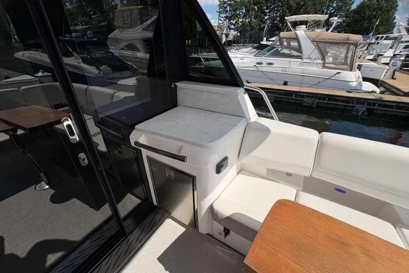 Slide: The Image of Luxurious interior of 2019 Regal 42 Fly yacht with seating and kitchenette. - 8