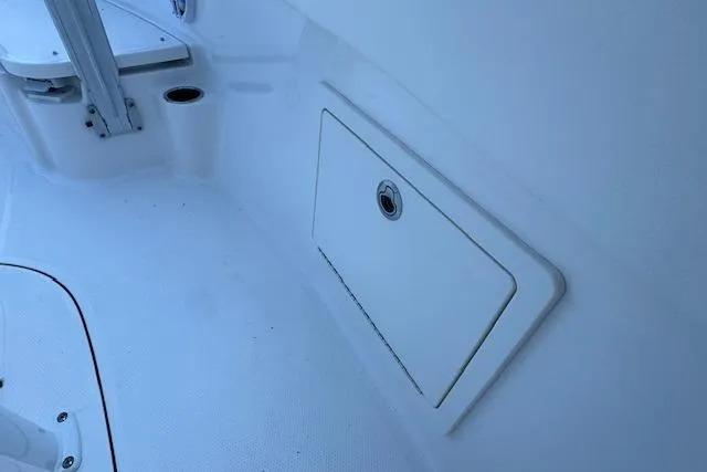 Slide: The Image of 2026 Robalo R230 Center Console boat interior storage compartment. - 13