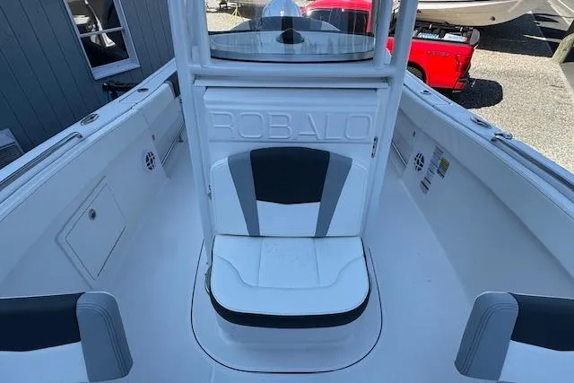 Slide: The Image of 2026 Robalo R230 Center Console boat interior with seating and console view. - 18