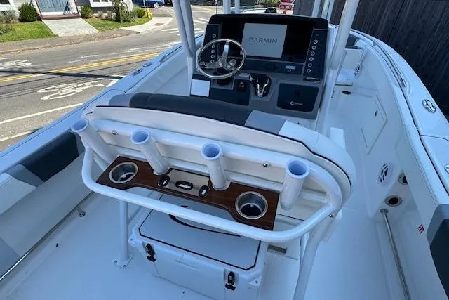 Slide: The Image of 2026 Robalo R230 Center Console boat interior with Garmin navigation system. - 7