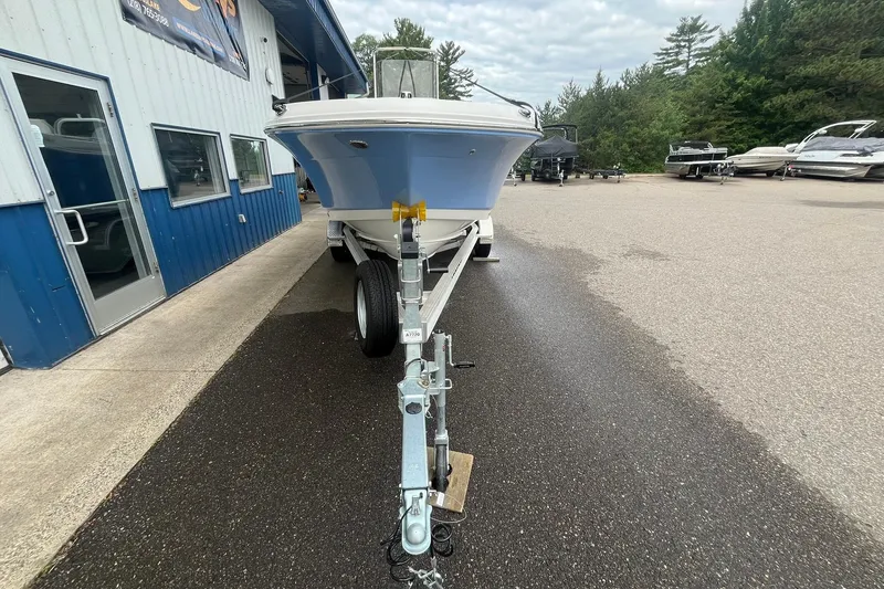 Slide: The Image of 2023 Robalo R200 Center Console boat on trailer outside dealership. - 22