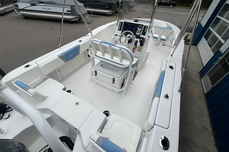 Slide: The Image of 2023 Robalo R200 Center Console boat interior with seating and steering console. - 24