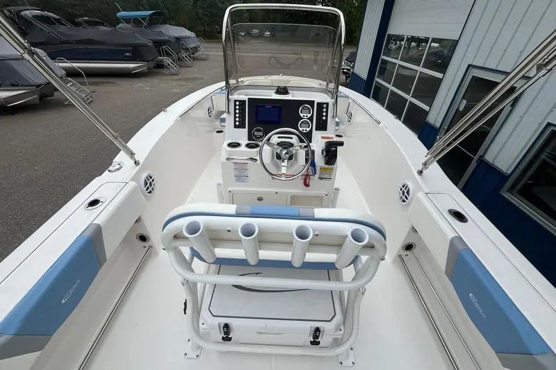 Slide: The Image of 2023 Robalo R200 Center Console boat interior with steering wheel and control panel. - 25