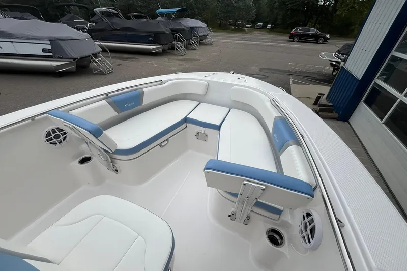 Slide: The Image of 2023 Robalo R200 Center Console boat interior with blue and white seating. - 28