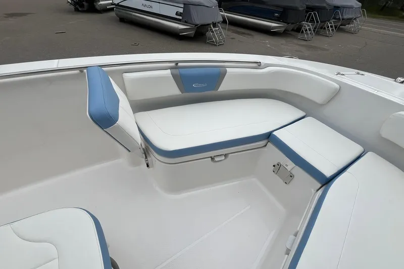 Slide: The Image of 2023 Robalo R200 Center Console boat interior with white and blue seating. - 29