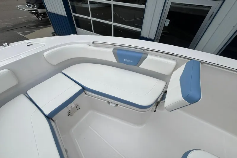 Slide: The Image of 2023 Robalo R200 Center Console boat interior with white and blue cushioned seating. - 30