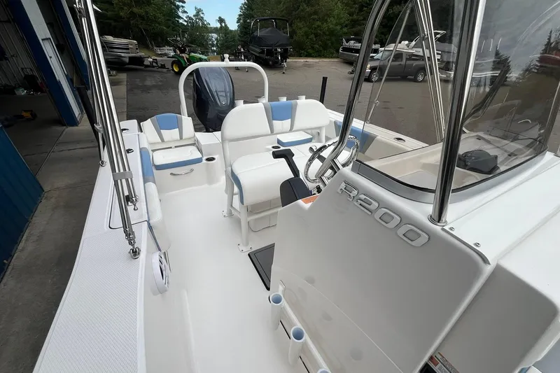Slide: The Image of 2023 Robalo R200 Center Console boat with sleek design and spacious deck. - 33