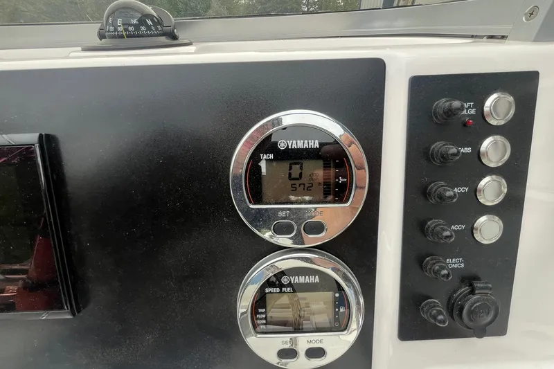 Slide: The Image of Dashboard of 2023 Robalo R200 Center Console with Yamaha gauges and controls. - 37