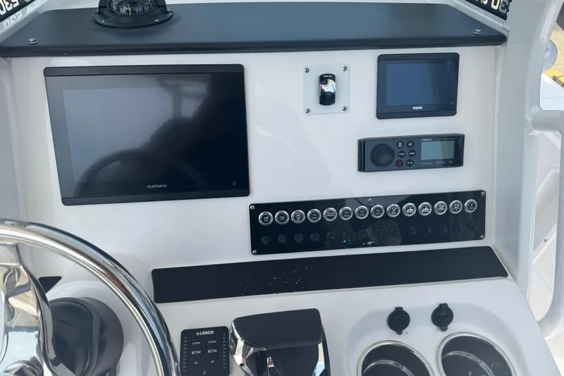 Slide: The Image of Edgewater 230CC 2026 boat dashboard with Garmin and Yamaha displays. - 17