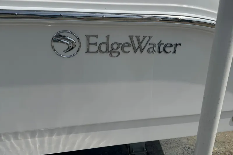 Slide: The Image of EdgeWater 230CC boat logo on white hull, 2026 model. - 22