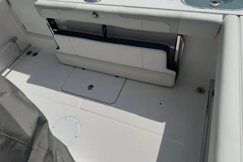 Slide: The Image of 2026 Edgewater 230CC boat interior with foldable seating and storage compartments. - 24