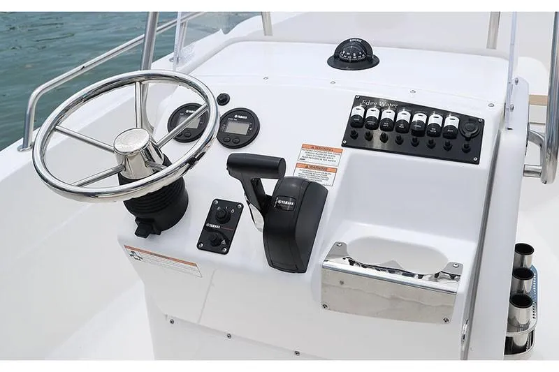 Slide: The Image of 2026 Edgewater 170CC boat interior with beige seating and storage compartment. - 3