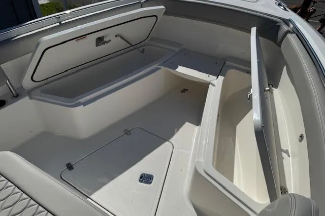 Slide: The Image of 2026 Pursuit S 268 Sport boat storage compartments, open and spacious design. - 14