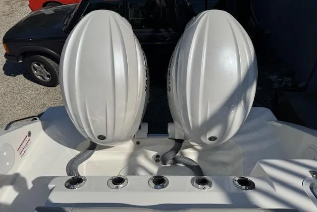 Slide: The Image of 2026 Pursuit S 268 Sport boat with dual outboard engines, viewed from the rear. - 7