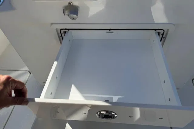 Slide: The Image of Open storage compartment on 2026 Pursuit S 268 Sport boat. - 9