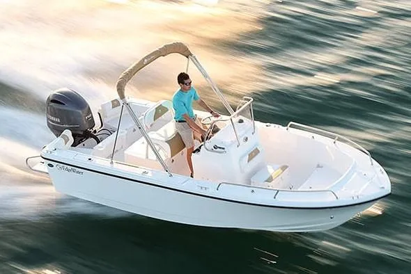The Image of 2026 Edgewater 188CC boat on trailer, parked outdoors, with Yamaha engine. - 0