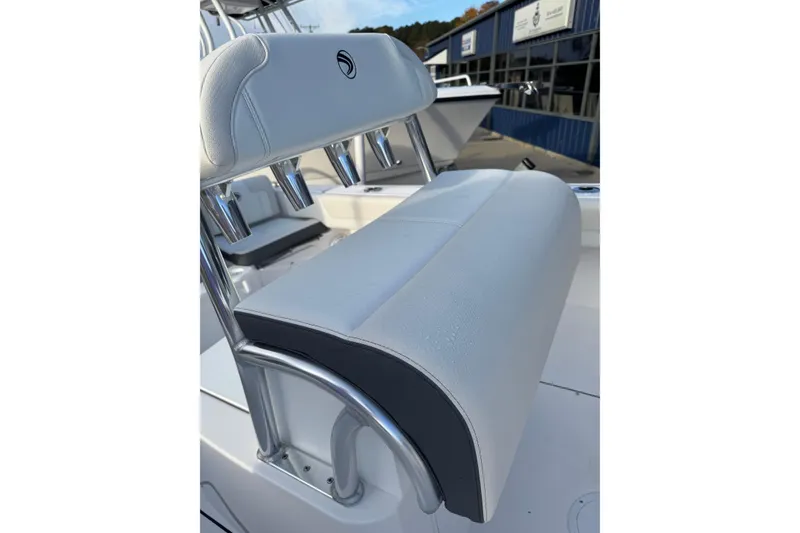 Slide: The Image of 2026 Edgewater 188CC boat seat with rod holders, outdoor setting. - 11