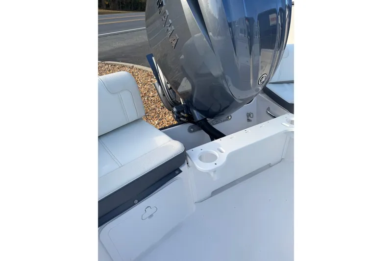 Slide: The Image of 2026 Edgewater 188CC boat with Yamaha engine, featuring white seating and cup holders. - 12