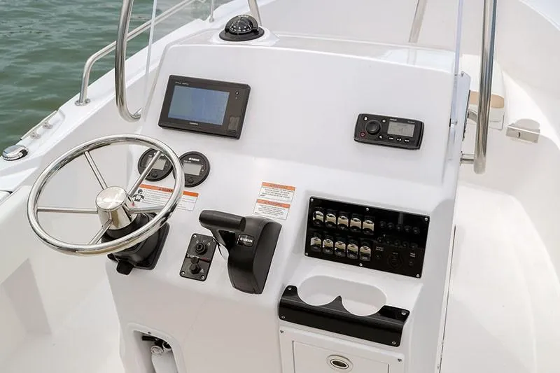 Slide: The Image of 2026 Edgewater 188CC boat interior, featuring control panel and storage compartments. - 4