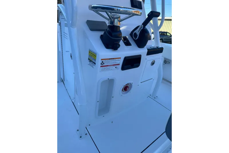 Slide: The Image of 2026 Edgewater 208CC boat console with steering wheel and controls. - 9