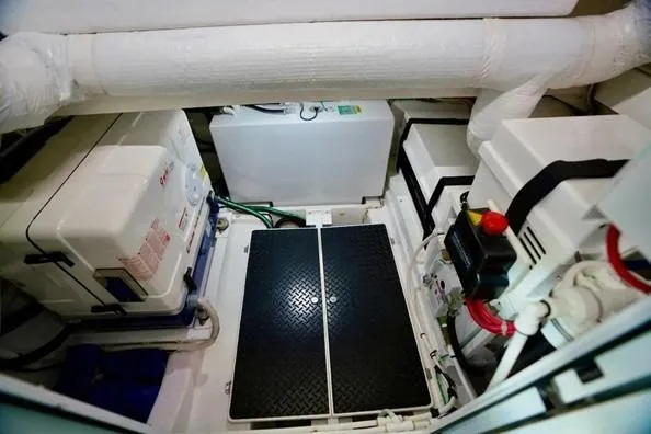 Slide: The Image of Engine room of 2021 Valhalla Boatworks V-46, featuring equipment and piping. - 17