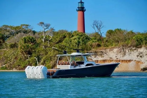Slide: The Image of 2021 Valhalla Boatworks V-46 cruising near a lighthouse on a sunny day. - 3