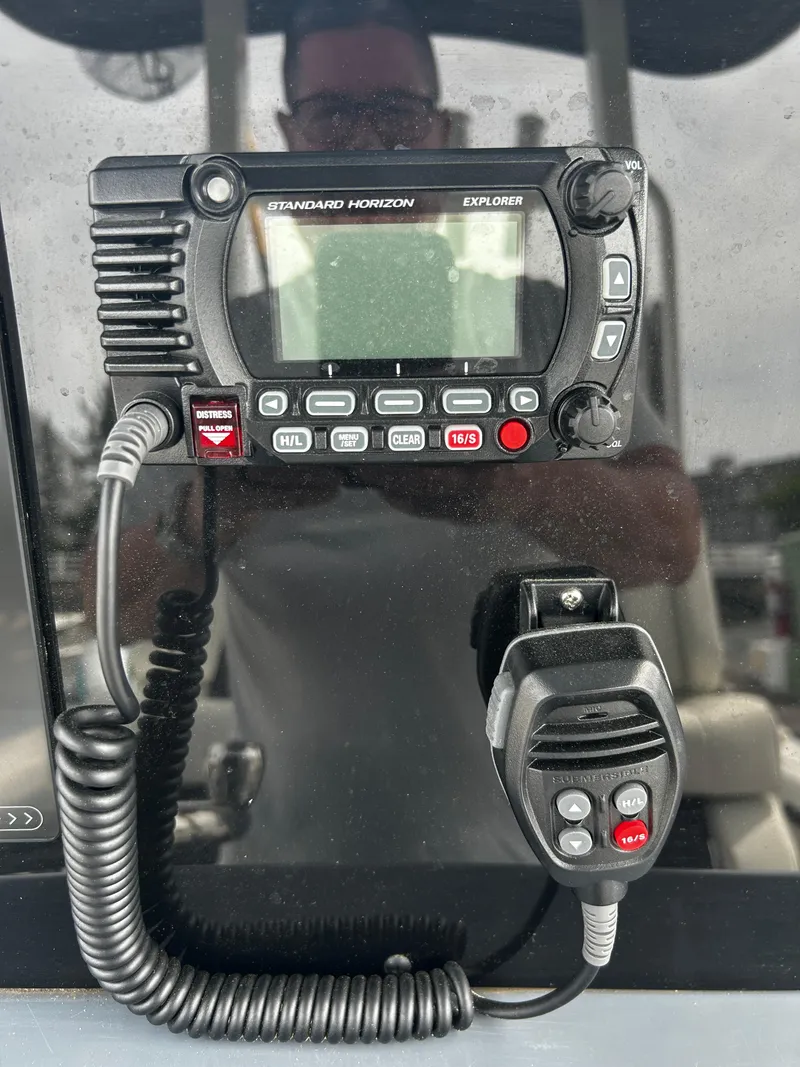 Slide: The Image of 2024 Tidewater 280 CC Adventure boat radio system with microphone. - 15