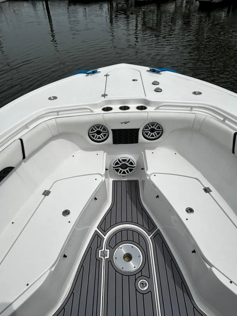 Slide: The Image of 2024 Tidewater 280 CC Adventure boat interior with seating and speakers. - 36