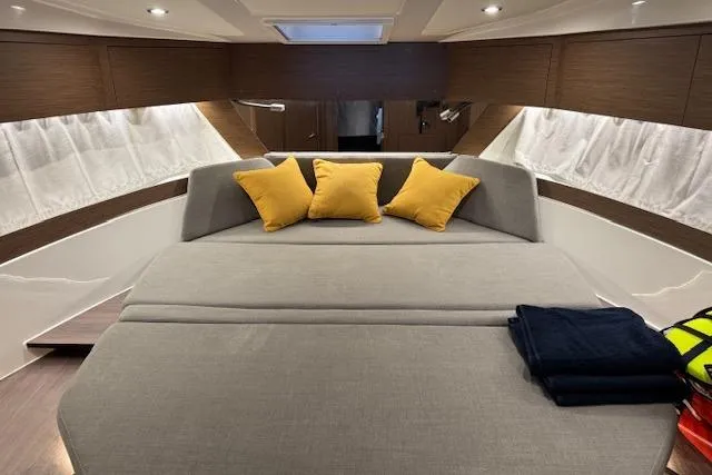 Slide: The Image of Luxurious cabin interior of 2025 Beneteau Antares 11 Fly with cozy bedding and cushions. - 11
