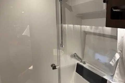 Slide: The Image of 2025 Beneteau Antares 11 Fly bathroom with modern fixtures and sleek design. - 14