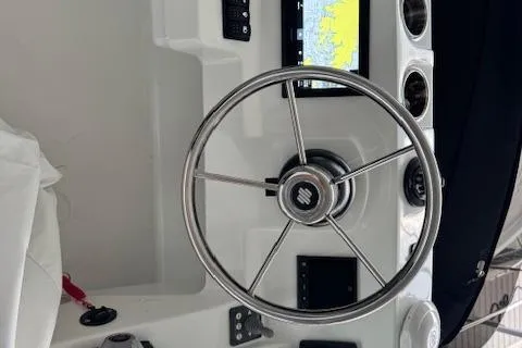 Slide: The Image of Steering wheel and controls of 2025 Beneteau Antares 11 Fly boat. - 7