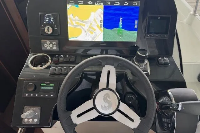 Slide: The Image of 2025 Beneteau Antares 11 Fly helm with navigation display and controls. - 9