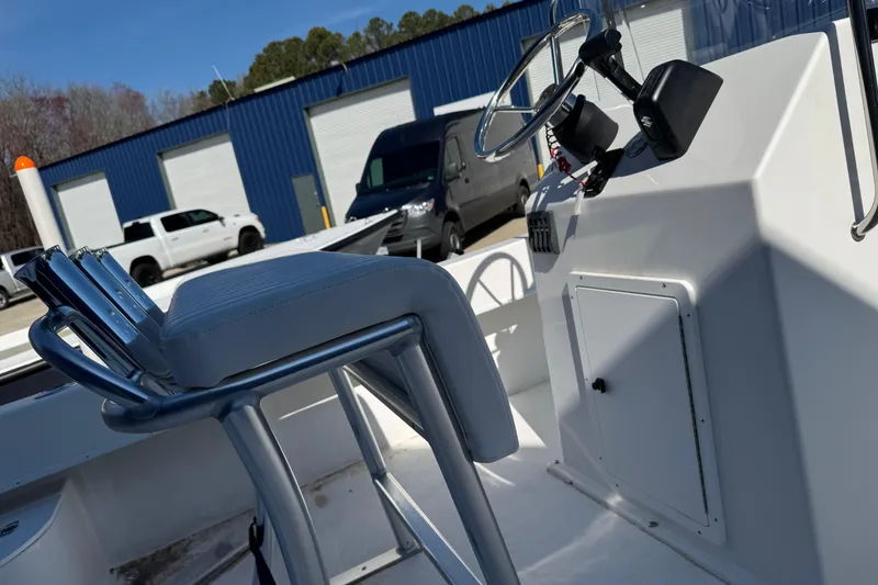 Slide: The Image of 2026 C-Hawk 200 Center Console boat interior with steering wheel and seating. - 10